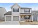 Charming two-story home with a two-car garage and stone accents at 55 Mable Court # 5, Lillington, NC 27546