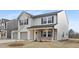 Charming two-story home with a two-car garage and stone accents at 55 Mable Court # 5, Lillington, NC 27546
