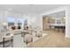 Open concept living room flowing into kitchen space with natural lighting at 55 Mable Court # 5, Lillington, NC 27546