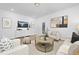 Bright living room featuring modern decor, plush seating, stylish accents, and lots of natural light at 55 Mable Court # 5, Lillington, NC 27546