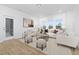 Bright living room with large windows and neutral decor at 55 Mable Court # 5, Lillington, NC 27546