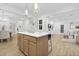 Open concept living room with an island and an easy flow to dining and living spaces at 55 Mable Court # 5, Lillington, NC 27546