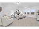 Spacious main bedroom with neutral tones, large windows, comfortable seating, and elegant furnishings at 55 Mable Court # 5, Lillington, NC 27546