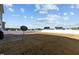 Expansive backyard with brown grass, white fence, and room for outdoor activities at 5601 Garnet Meadow Rd, Knightdale, NC 27545