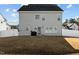 Back exterior of home featuring a patio, fenced backyard, and ample lawn space at 5601 Garnet Meadow Rd, Knightdale, NC 27545