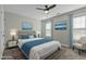 Comfortable bedroom offers a ceiling fan, stylish decor, comfortable bed with coordinated pillows and decor at 5601 Garnet Meadow Rd, Knightdale, NC 27545