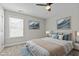 Cozy bedroom with neutral colors and a window providing natural light at 5601 Garnet Meadow Rd, Knightdale, NC 27545