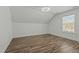 Bright bedroom features a ceiling fan, wood floors, natural light, and neutral walls at 5601 Garnet Meadow Rd, Knightdale, NC 27545