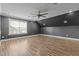 The bonus room features recessed lights, gray walls, wood floors, and a window at 5601 Garnet Meadow Rd, Knightdale, NC 27545