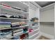 Walk-in closet with built-in white shelving for optimal storage and organization at 5601 Garnet Meadow Rd, Knightdale, NC 27545