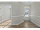 Bright foyer with hardwood floors and elegant trim, creating a welcoming entrance to the home at 5601 Garnet Meadow Rd, Knightdale, NC 27545