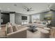 Spacious living room features recessed lights, ceiling fan, gray walls and comfortable seating at 5601 Garnet Meadow Rd, Knightdale, NC 27545