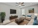 Comfortable living room with a large television and bright furniture at 5601 Garnet Meadow Rd, Knightdale, NC 27545