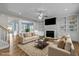 Spacious living room features built-in bookshelves, fireplace, modern ceiling fan, and wood floors at 5601 Garnet Meadow Rd, Knightdale, NC 27545