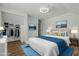 Bright main bedroom features a ceiling fan, stylish decor, closet, and a comfortable bed at 5601 Garnet Meadow Rd, Knightdale, NC 27545