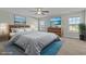 This main bedroom features calming colors, a ceiling fan, and two picturesque windows at 5601 Garnet Meadow Rd, Knightdale, NC 27545