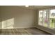 Bright bedroom with hardwood floors and large window at 5780 Plain View Hwy, Dunn, NC 28334