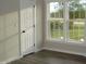 Bedroom with views from the windows, and a closet for storage at 5780 Plain View Hwy, Dunn, NC 28334