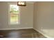 Inviting living room with natural light, hardwood floors, and neutral wall colors at 5780 Plain View Hwy, Dunn, NC 28334
