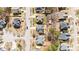 Aerial view of several homes in a neighborhood, showing manicured lawns and tree-lined streets at 613 Holly Thorn Trce, Holly Springs, NC 27540