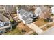 A two-story house with a garage, a driveway, and an enclosed garden at 613 Holly Thorn Trce, Holly Springs, NC 27540