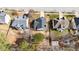 Aerial view of a home featuring a large backyard, a wooden deck, and mature trees at 613 Holly Thorn Trce, Holly Springs, NC 27540