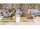 A two-story house with a driveway, a garage, and mature trees at 613 Holly Thorn Trce, Holly Springs, NC 27540