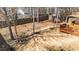 Overhead view of backyard with wooden deck, rocks and trees at 613 Holly Thorn Trce, Holly Springs, NC 27540
