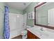 Well-maintained bathroom with a shower-tub combo and coordinated decor at 613 Holly Thorn Trce, Holly Springs, NC 27540