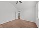 Clean bedroom with a neutral color palette and a view into another room at 613 Holly Thorn Trce, Holly Springs, NC 27540