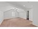 Spacious bedroom with neutral tones and a ceiling fan for comfortable living at 613 Holly Thorn Trce, Holly Springs, NC 27540