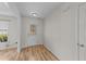 Entryway with wood flooring, a decorative front door, and white trim at 613 Holly Thorn Trce, Holly Springs, NC 27540