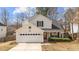 Charming two-story home with a two-car garage and well-manicured landscaping at 613 Holly Thorn Trce, Holly Springs, NC 27540
