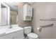 Bright bathroom features white fixtures, cabinet, and a shower with glass door at 627 W Front St # C, Burlington, NC 27215