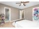 Bedroom with hardwood floor and a ceiling fan, and adjacent bathroom at 627 W Front St # C, Burlington, NC 27215