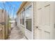 Exterior shot of the home featuring the back entrance, siding, and nearby sidewalk at 627 W Front St # C, Burlington, NC 27215