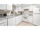 A well-lit kitchen with white cabinetry, modern appliances and a view of the sink at 627 W Front St # C, Burlington, NC 27215