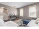 Bright living room with sofas, a console table, and light wood flooring, filled with natural light at 627 W Front St # C, Burlington, NC 27215