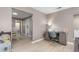 Bright room featuring a desk, chair, and views into the dining and kitchen areas at 627 W Front St # C, Burlington, NC 27215