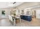 Bright dining room with table and chairs, with view of kitchen, and door to backyard at 6320 Bayswater Trl, Raleigh, NC 27612