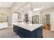 Bright and spacious kitchen with large island, pendant lighting, stainless steel appliances, and white cabinetry at 6320 Bayswater Trl, Raleigh, NC 27612