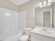 Bathroom with white sink, toilet, and tub at 706 Canyon Lake Cir, Morrisville, NC 27560