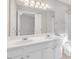 Bathroom with dual sinks, large mirror, and a separate toilet area at 706 Canyon Lake Cir, Morrisville, NC 27560
