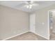 Neutral bedroom with ceiling fan and carpeted floors at 706 Canyon Lake Cir, Morrisville, NC 27560