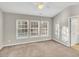 Spacious bedroom with large windows and carpeted floors at 706 Canyon Lake Cir, Morrisville, NC 27560