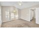 Primary bedroom featuring large windows and walk-in closet at 706 Canyon Lake Cir, Morrisville, NC 27560