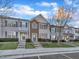 Charming townhome featuring a well-maintained lawn and inviting front entrance at 706 Canyon Lake Cir, Morrisville, NC 27560