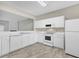Well-equipped kitchen with white cabinetry, modern appliances, and plenty of counter space at 706 Canyon Lake Cir, Morrisville, NC 27560