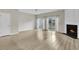 Spacious living room features beautiful hardwood floors and a fireplace for a cozy ambiance at 706 Canyon Lake Cir, Morrisville, NC 27560