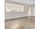 Open concept living area featuring hardwood floors and great natural light at 706 Canyon Lake Cir, Morrisville, NC 27560